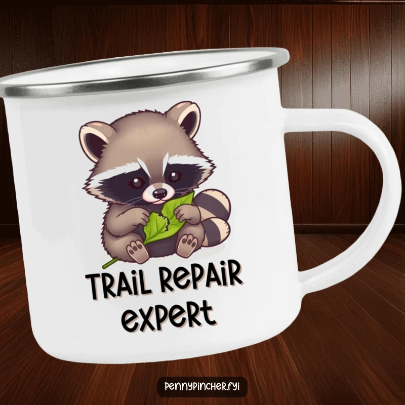 Funny camping mug with a clever raccoon meticulously mending a tiny torn leaf, perfect for outdoor enthusiasts.