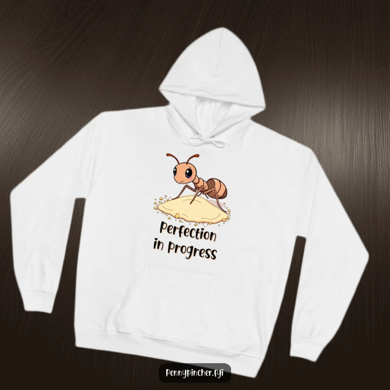 Funny hoodie showcasing a diligent ant meticulously sorting grains of sand, highlighting its commitment to detail.
