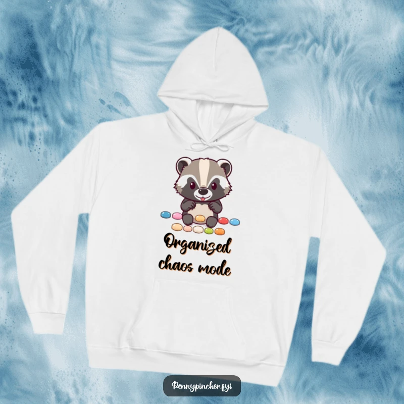 Funny hoodie with a diligent badger character carefully placing shiny buttons in a perfect row, ideal for cold days.